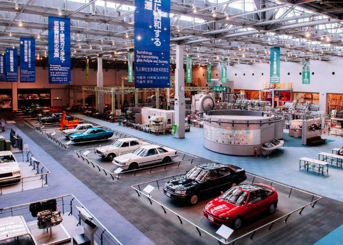 The interior of at the Toyota Commemorative Museum of Industry and Technology, showing a selection of Toyota's cars.